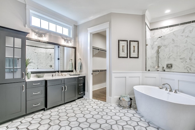 bathroom with vanity, independent shower and bath, and crown molding