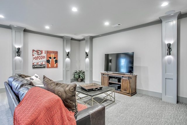 carpeted living room featuring decorative columns and ornamental molding