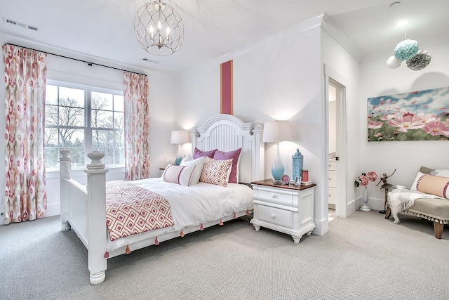 bedroom featuring carpet and a notable chandelier