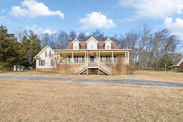 view of front of house featuring a front yard and a porch