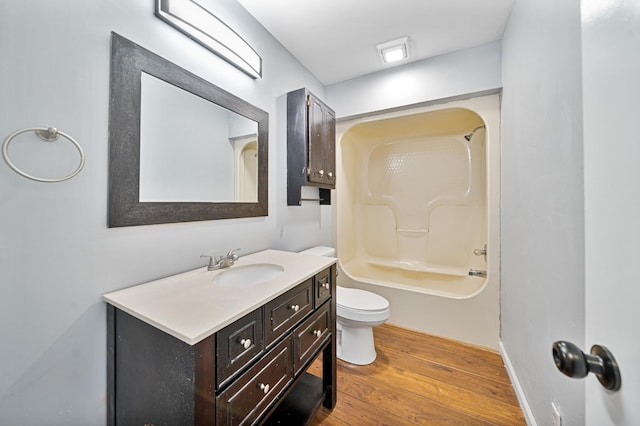 full bathroom with toilet, bathing tub / shower combination, vanity, and hardwood / wood-style flooring