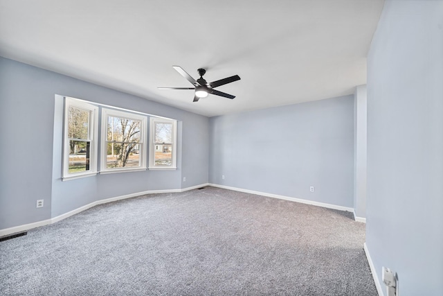 carpeted empty room with ceiling fan