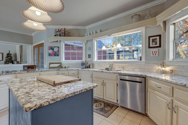 kitchen featuring dishwasher, pendant lighting, decorative backsplash, a kitchen island, and sink