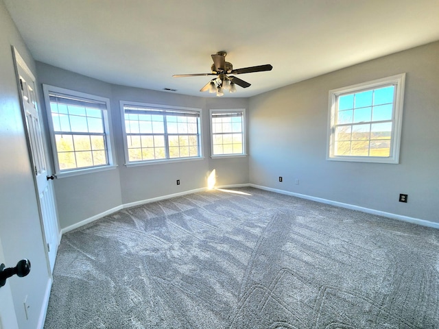 carpeted empty room with ceiling fan