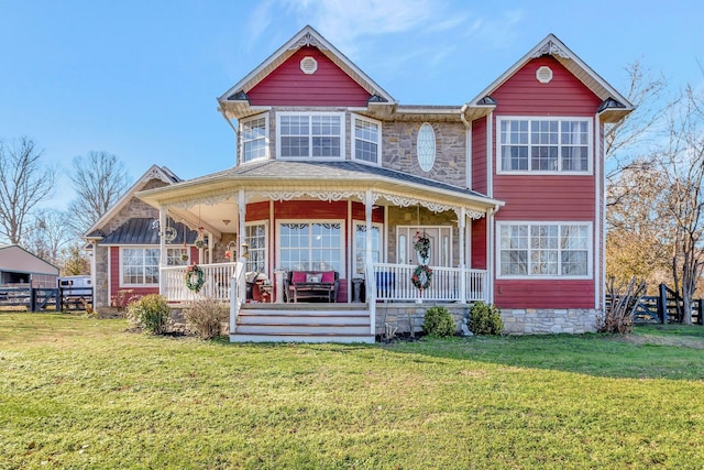 view of front of house with a porch and a front lawn