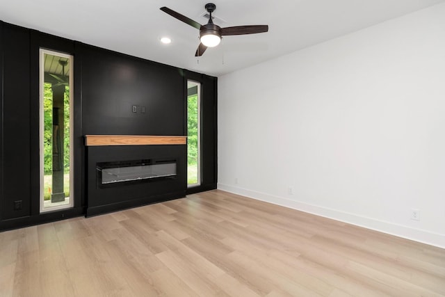 foyer entrance with light hardwood / wood-style flooring, ceiling fan, and plenty of natural light