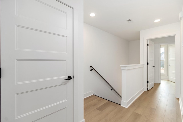 corridor featuring light hardwood / wood-style flooring