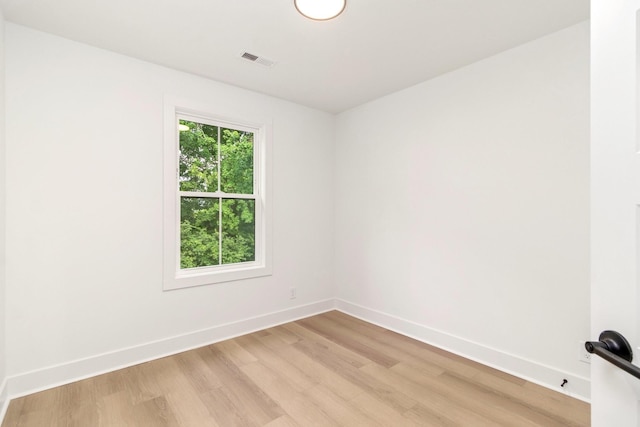 spare room with light hardwood / wood-style floors