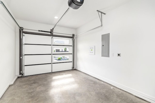 garage featuring a garage door opener and electric panel