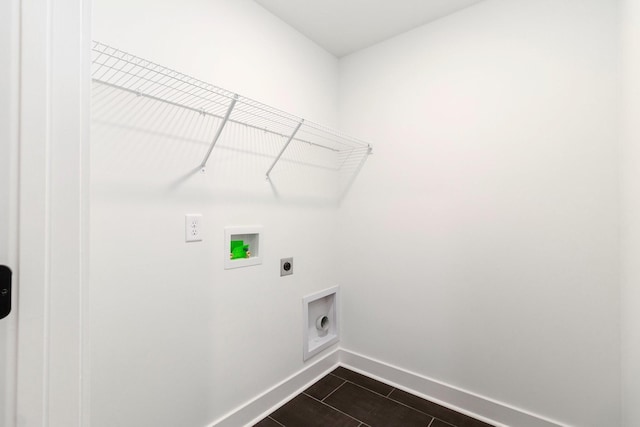 laundry area featuring washer hookup, hookup for an electric dryer, and dark tile patterned flooring