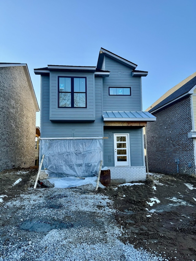 view of snow covered house