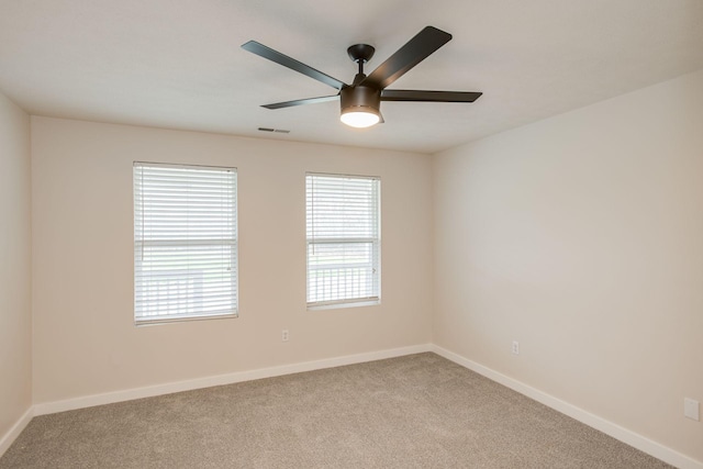 carpeted empty room with ceiling fan