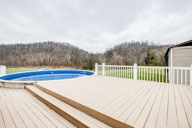 view of pool featuring a wooden deck