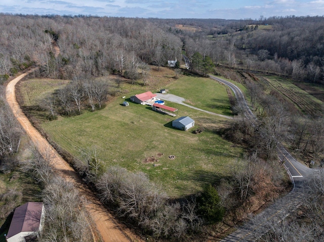 birds eye view of property with a rural view