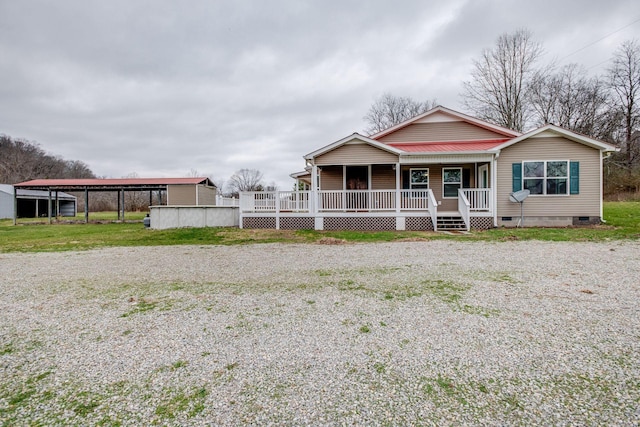 view of front facade with a porch and a carport