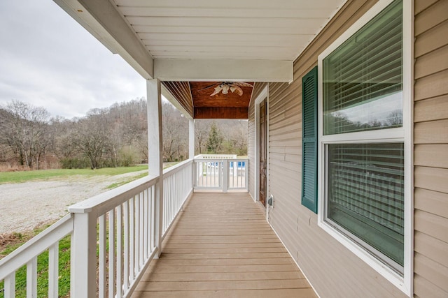 wooden deck with ceiling fan