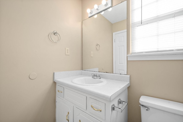 bathroom with toilet and vanity