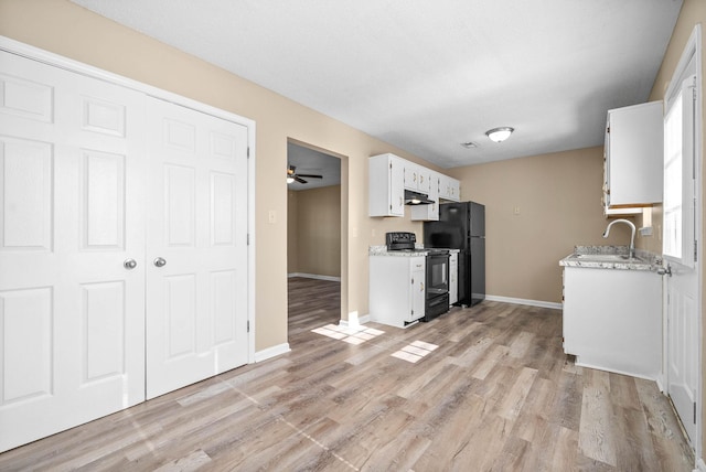 kitchen featuring sink, white cabinets, ceiling fan, light wood-type flooring, and black appliances