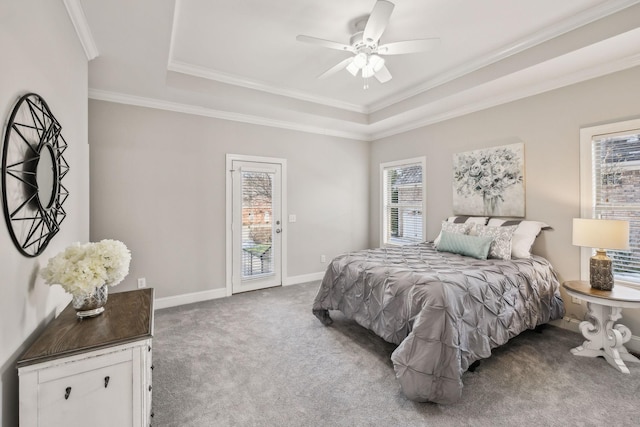 bedroom featuring access to outside, carpet, ceiling fan, and a tray ceiling