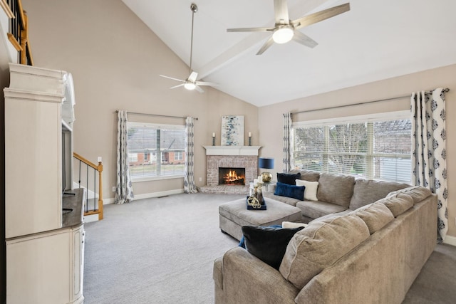 living room with ceiling fan, light colored carpet, high vaulted ceiling, and a wealth of natural light