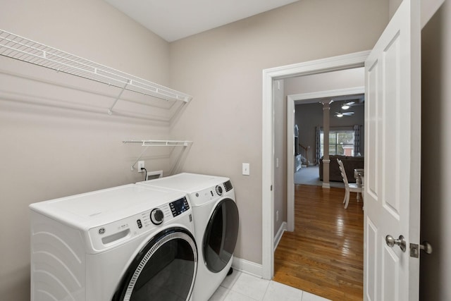 laundry area with ceiling fan, light tile patterned floors, and independent washer and dryer