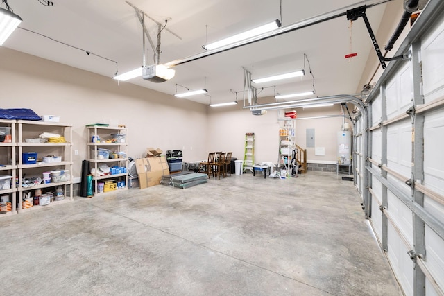 garage featuring electric panel, gas water heater, and a garage door opener