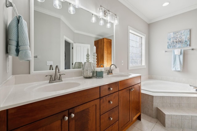 bathroom with ornamental molding, tile patterned floors, tiled tub, and vanity