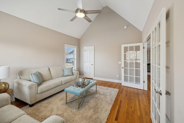 living room with french doors, high vaulted ceiling, wood-type flooring, and ceiling fan