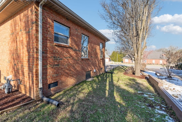 view of home's exterior featuring a yard