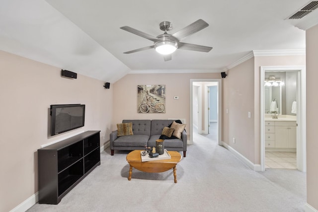 living room featuring vaulted ceiling, light colored carpet, ornamental molding, ceiling fan, and sink