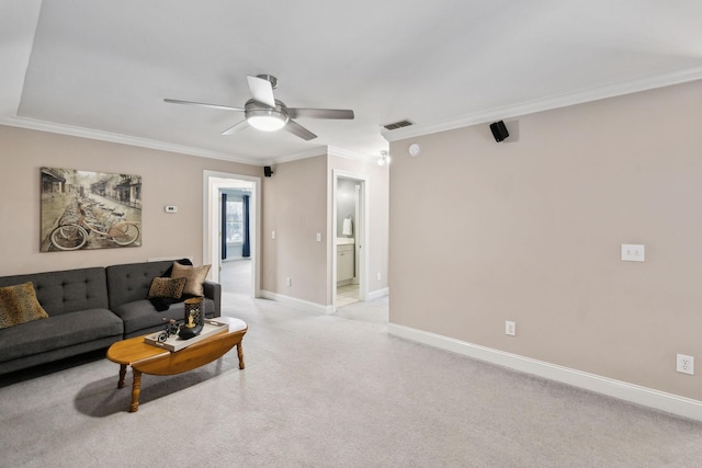 carpeted living room featuring ceiling fan and ornamental molding