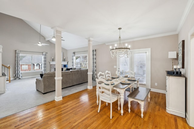 dining space featuring ceiling fan with notable chandelier, light wood-type flooring, and plenty of natural light