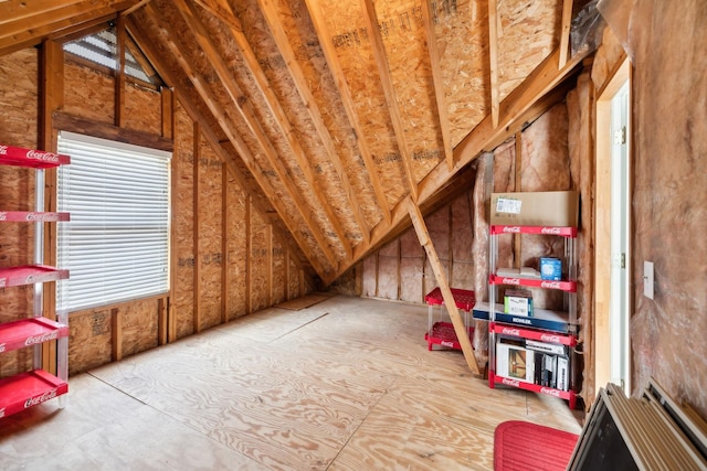 unfinished attic featuring plenty of natural light