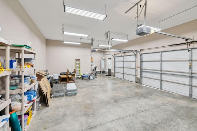 garage with a garage door opener and water heater