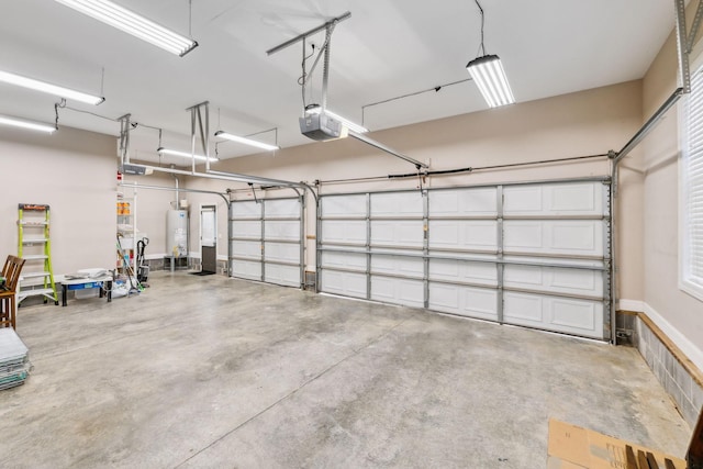 garage featuring gas water heater and a garage door opener