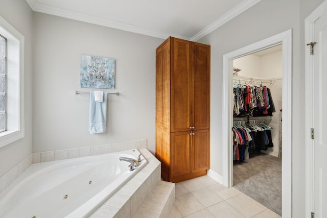 bathroom featuring tile patterned flooring, a relaxing tiled tub, plenty of natural light, and crown molding