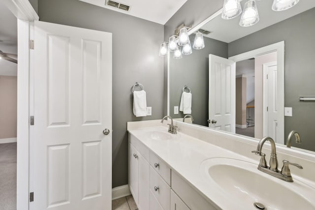 bathroom featuring ceiling fan, tile patterned flooring, and vanity