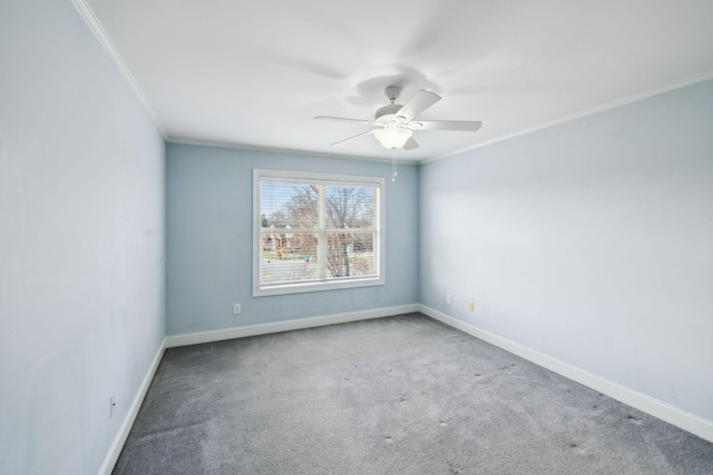 carpeted empty room featuring ceiling fan and ornamental molding