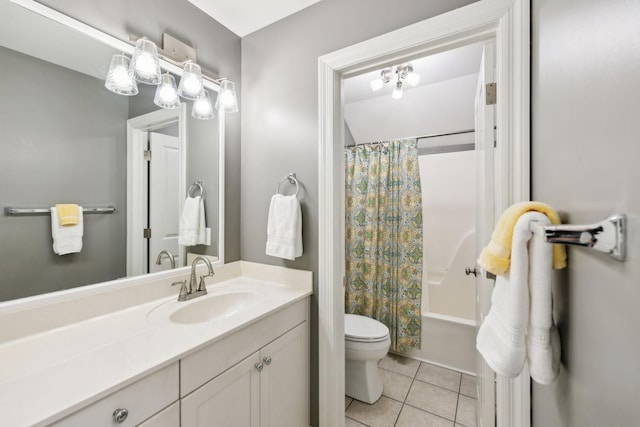 full bathroom with tile patterned flooring, toilet, vanity, and shower / bath combo