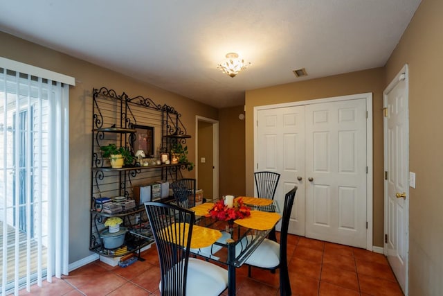 dining area featuring tile patterned floors