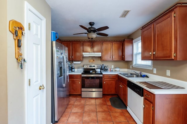 kitchen with ceiling fan, appliances with stainless steel finishes, sink, and light tile patterned floors