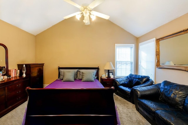 carpeted bedroom with vaulted ceiling and ceiling fan