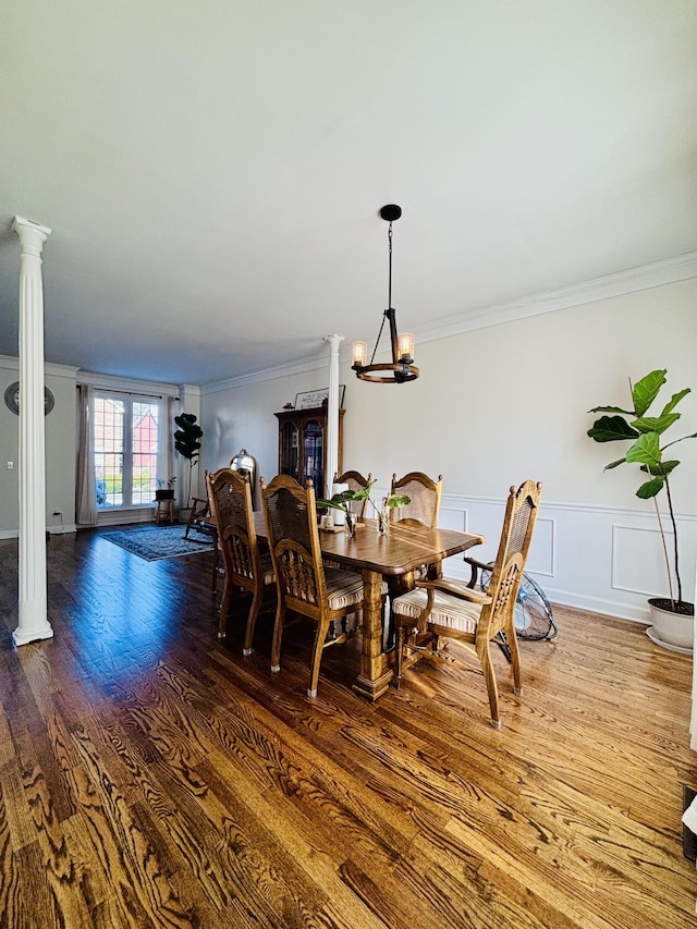 dining room featuring a notable chandelier, dark hardwood / wood-style flooring, french doors, and crown molding