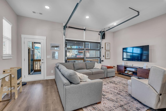 living room featuring a healthy amount of sunlight and light wood-type flooring