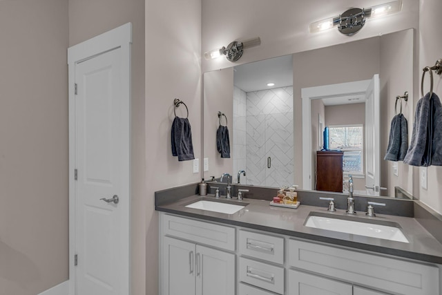 bathroom with an enclosed shower and vanity