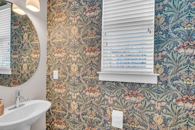 bathroom featuring a wealth of natural light and sink