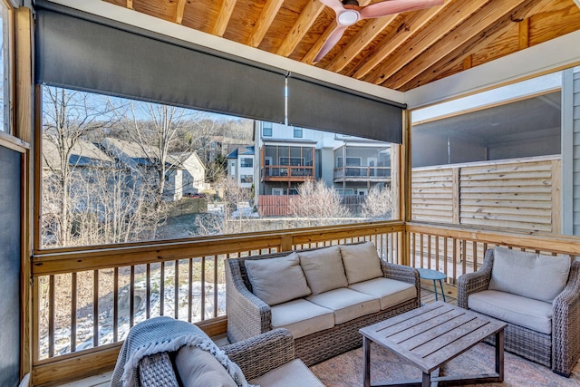 wooden deck featuring ceiling fan and outdoor lounge area