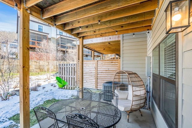 view of snow covered patio