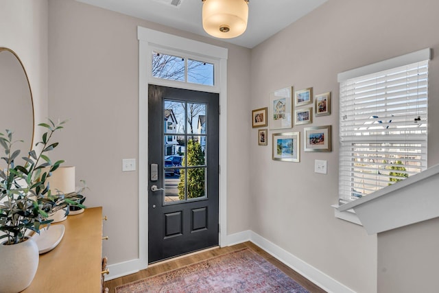 entryway featuring hardwood / wood-style flooring and plenty of natural light