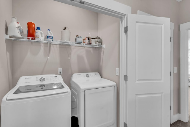 laundry area with washing machine and dryer